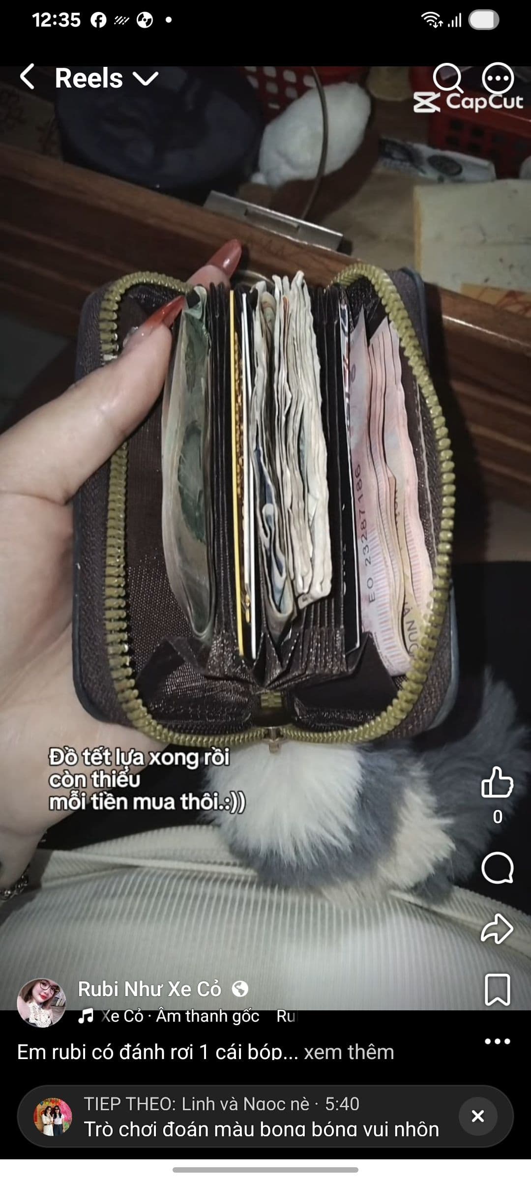 Tìm bóp tiền  và giấy  to 